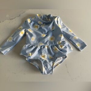 Carter’s baby bathing suit with daisies